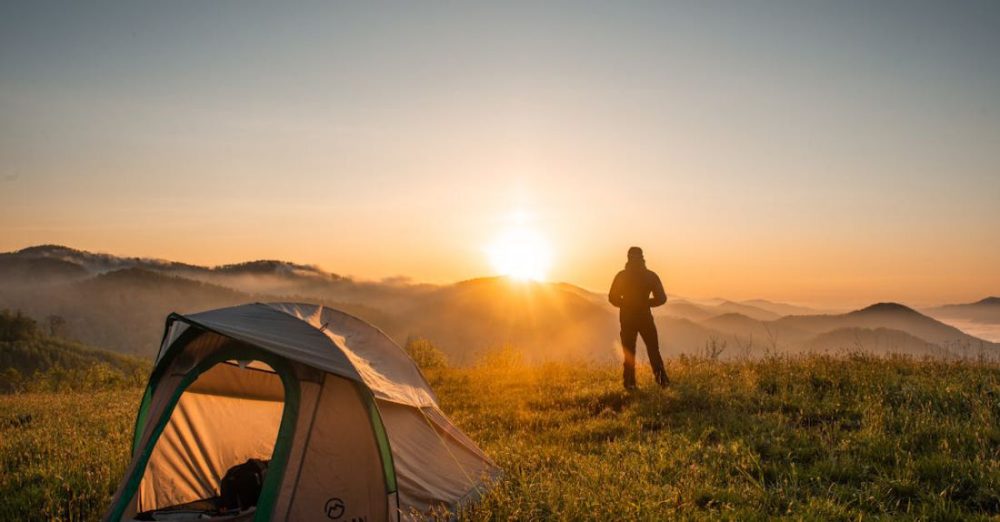 Camping - Silhouette of Person Standing Near Camping Tent