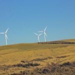 Conservation - Three White Windmills on Green Field Under Blue Sky