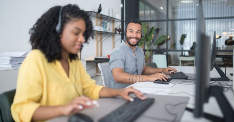 Calls - A Man and a Woman Working in Call Center